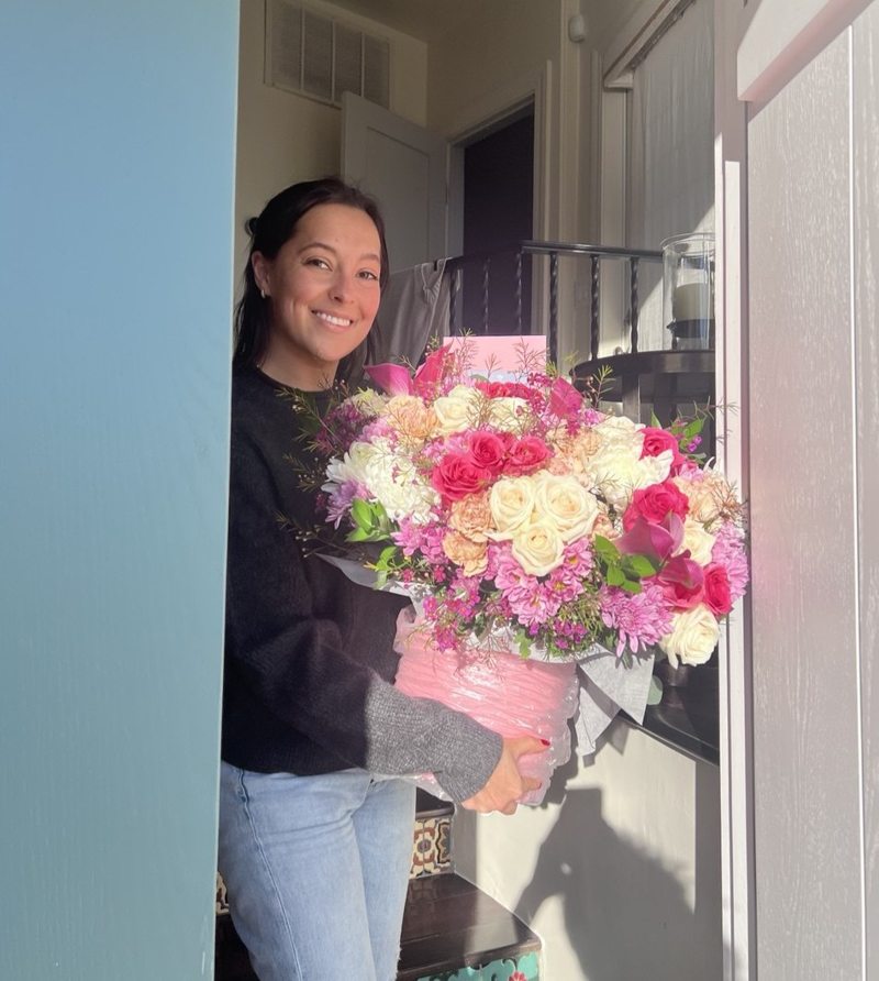 A customer receiving a Charm Flower Studio flower delivery in Los Angeles, photo 4