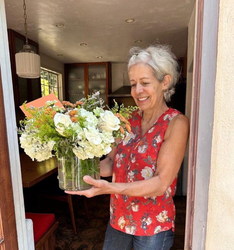 A customer receiving a Charm Flower Studio flower delivery in Los Angeles, photo 9