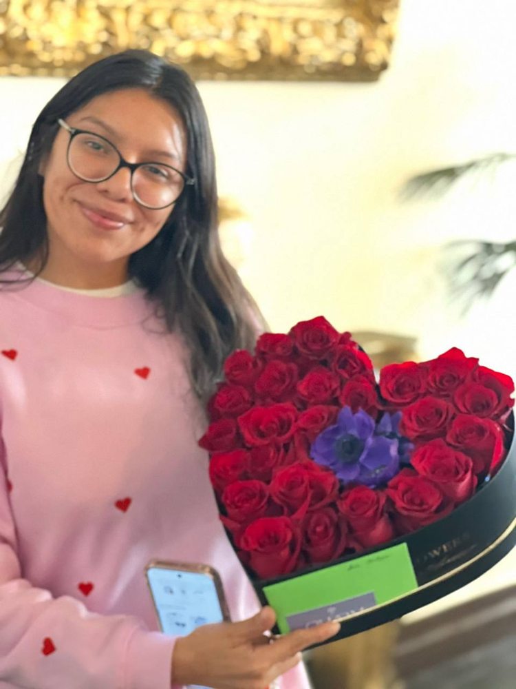 A customer receiving a Charm Flower Studio flower delivery in Los Angeles, photo 1