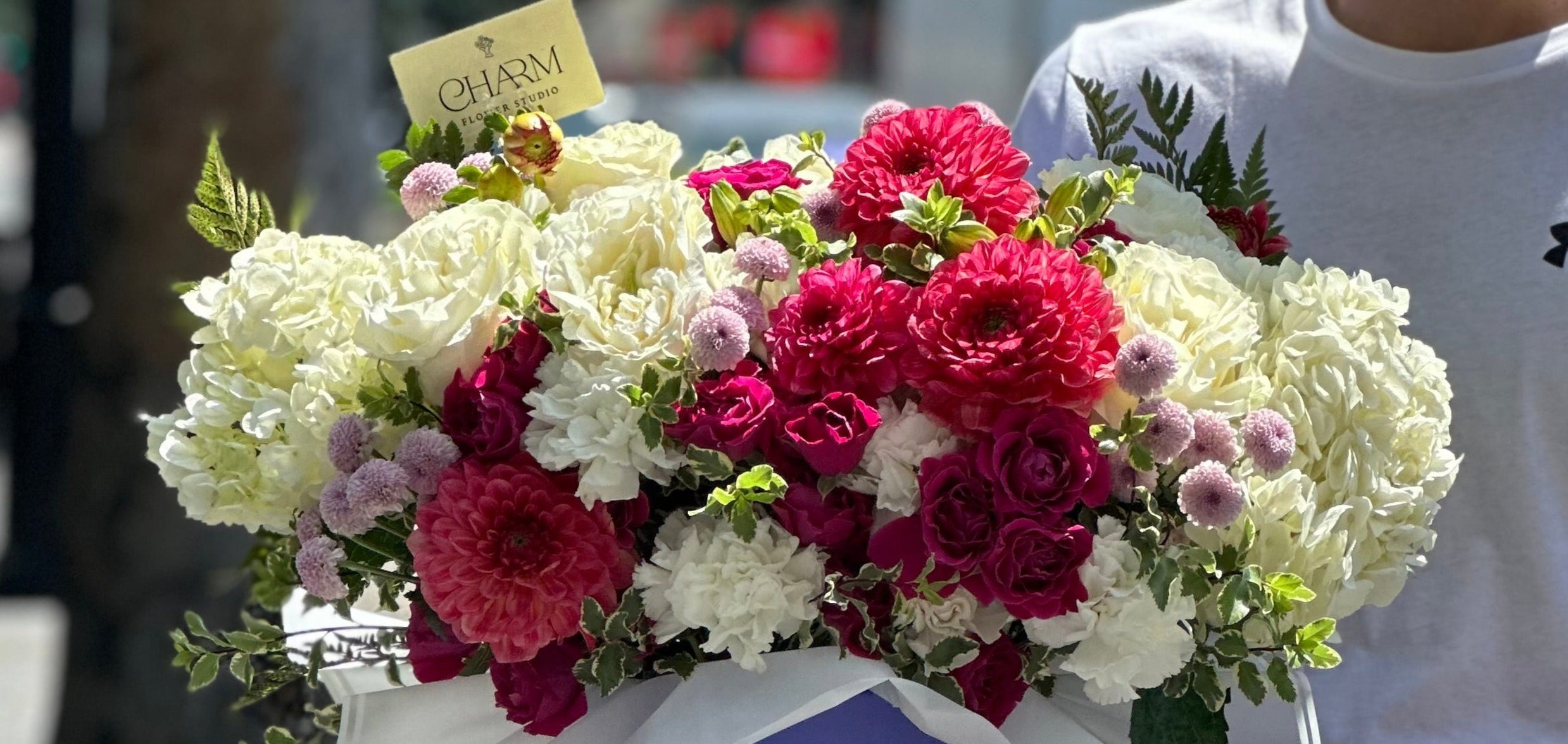 Vibrant floral box with burgundy dahlias, white hydrangeas, and lavender accents — luxury bouquet